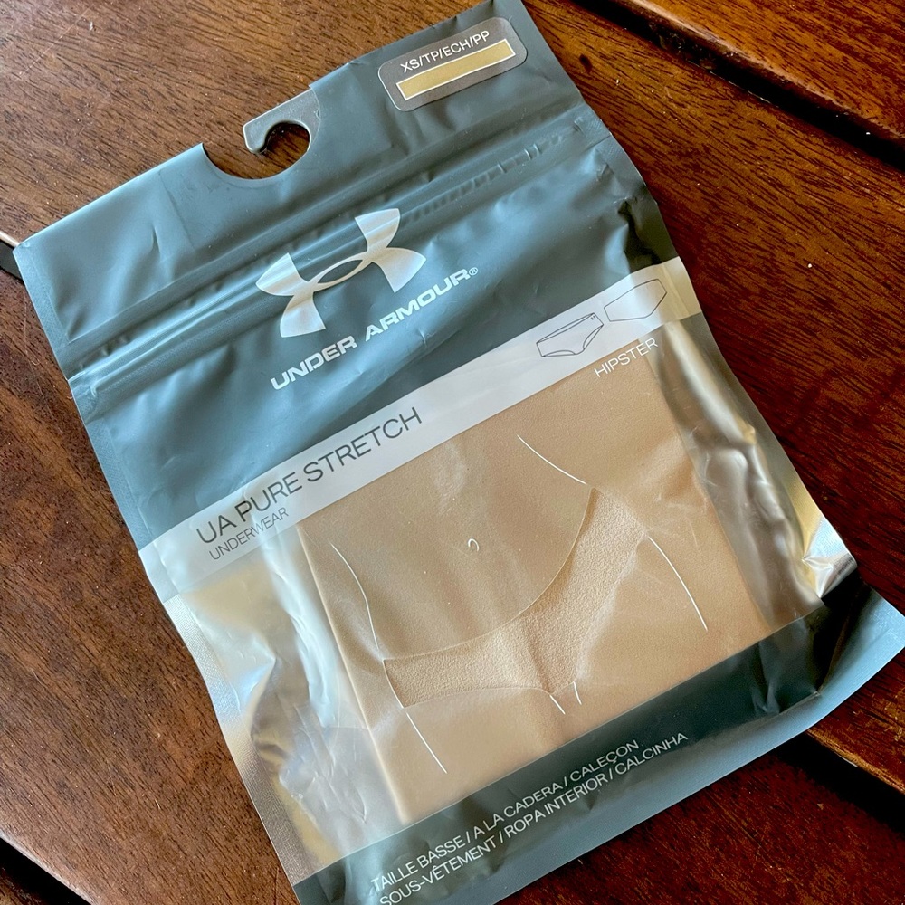 New. Never opened.  Under Armour UA Pure Stretch Hipsters.